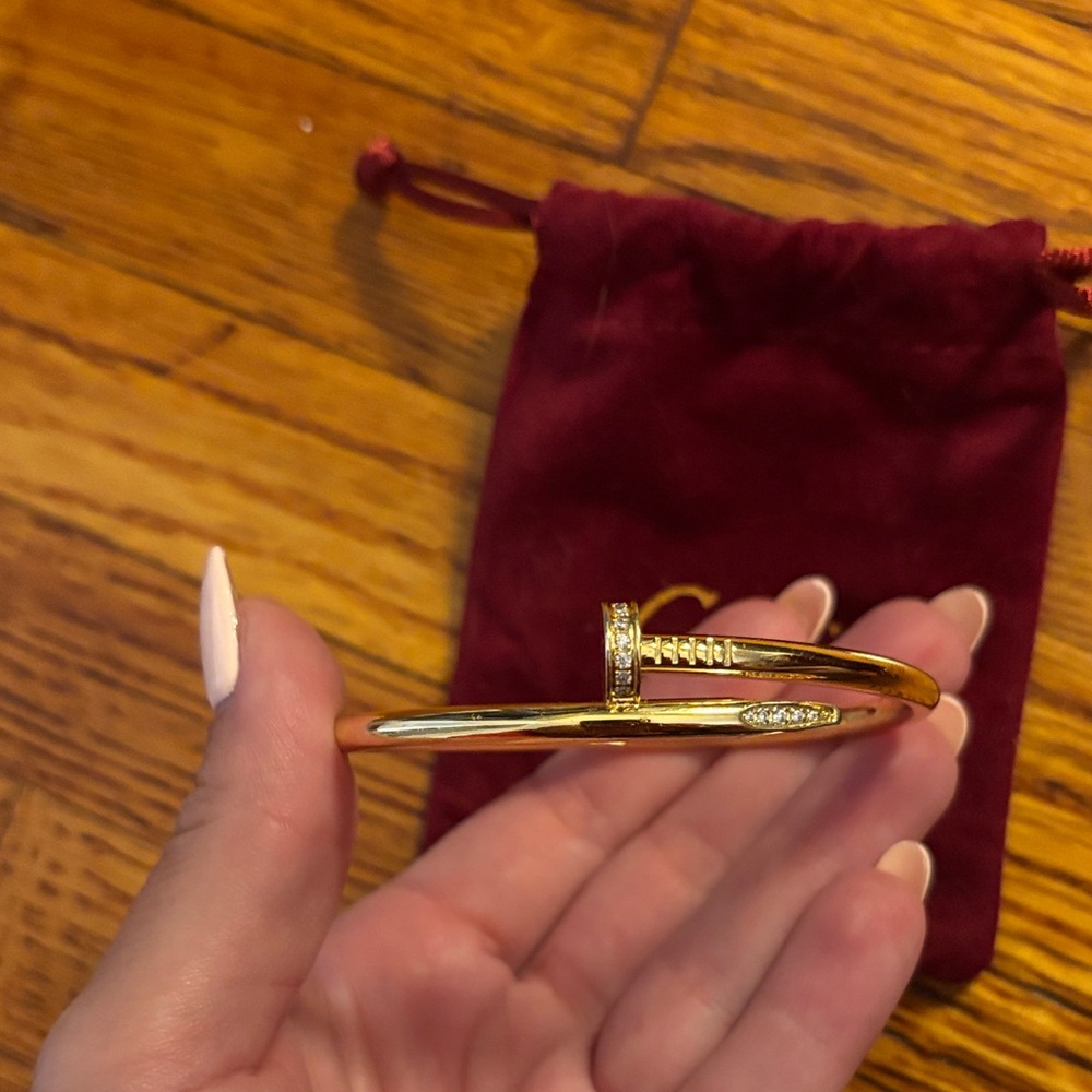 Gold nail bracelet with pouch